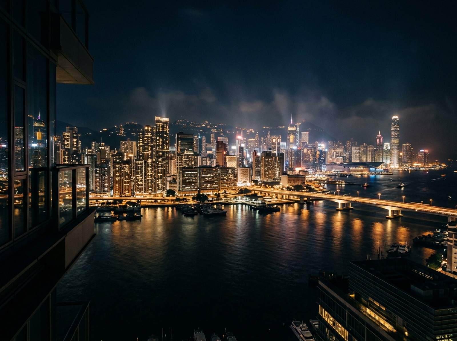 Harbour and skyline of a coastal metropolis glowing at night